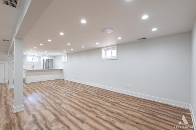 6012 S Narragansett Ave, Chicago, IL 60638 - unfurnished living room with recessed lighting, light wood-type flooring, and baseboards