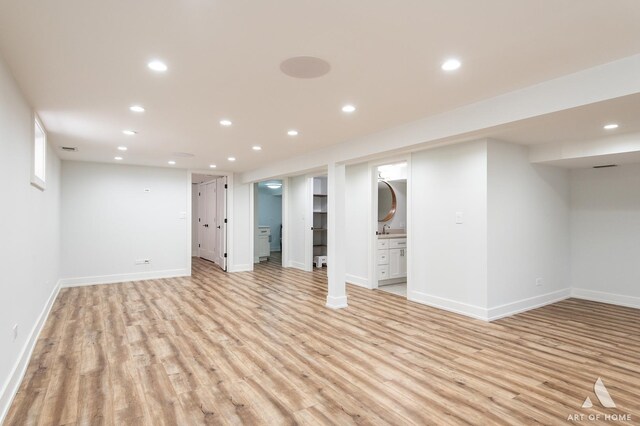 6012 S Narragansett Ave, Chicago, IL 60638 - finished basement featuring light wood-style flooring, recessed lighting, and baseboards