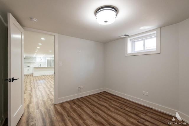 6012 S Narragansett Ave, Chicago, IL 60638 - empty room with wood finished floors and baseboards