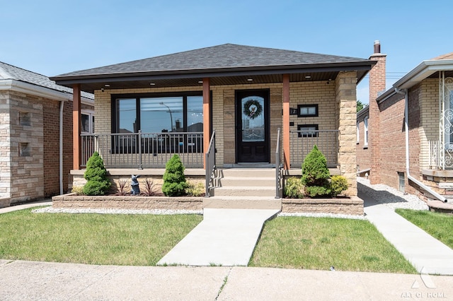 6012 S Narragansett Ave, Chicago, IL 60638 - view of front of home featuring covered porch, roof with shingles, and brick siding