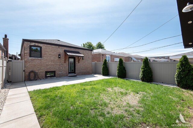 6012 S Narragansett Ave, Chicago, IL 60638 - back of property with brick siding and a patio area