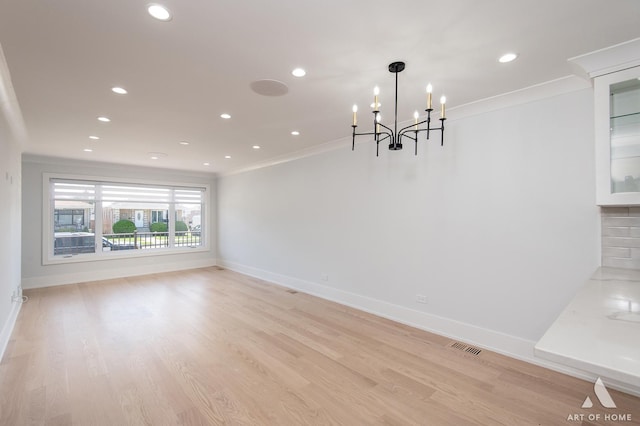 6012 S Narragansett Ave, Chicago, IL 60638 - unfurnished dining area featuring ornamental molding, recessed lighting, light wood-type flooring, baseboards, and a chandelier