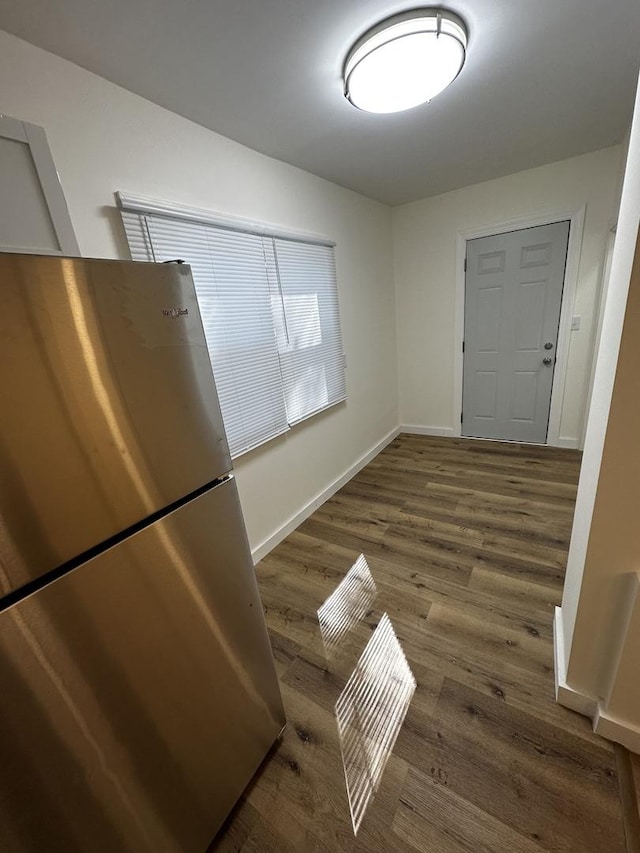 313 Grand Blvd, Loves Park, IL 61111 - unfurnished dining area featuring wood finished floors and baseboards