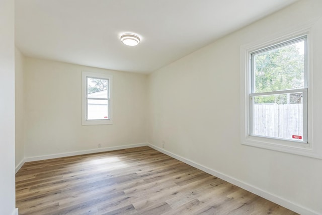 313 Grand Blvd, Loves Park, IL 61111 - spare room with light wood-style floors and baseboards