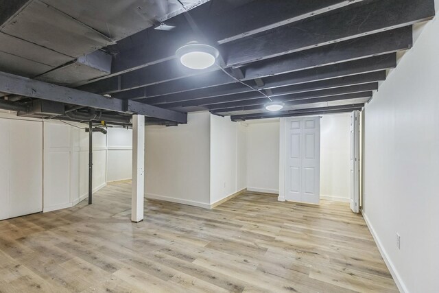 313 Grand Blvd, Loves Park, IL 61111 - finished basement featuring wood finished floors and baseboards