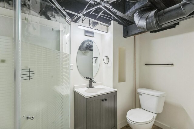 313 Grand Blvd, Loves Park, IL 61111 - bathroom featuring toilet, vanity, and a stall shower