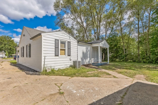 313 Grand Blvd, Loves Park, IL 61111 - view of property exterior with central air condition unit and a yard