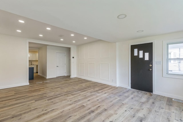 313 Grand Blvd, Loves Park, IL 61111 - foyer entrance with light wood-type flooring, recessed lighting, and baseboards