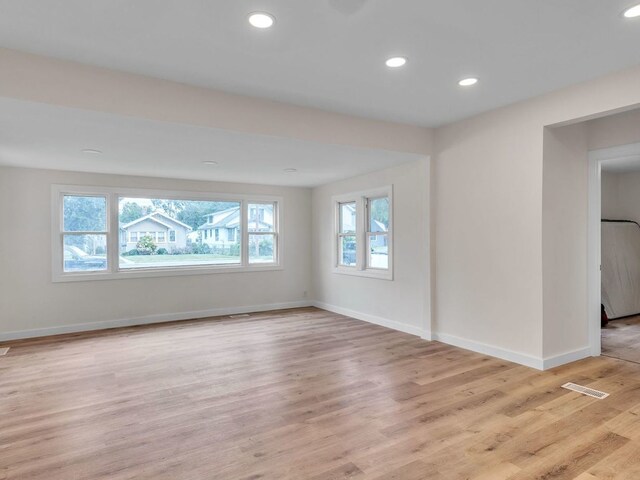 313 Grand Blvd, Loves Park, IL 61111 - unfurnished room with baseboards, light wood-style floors, and recessed lighting