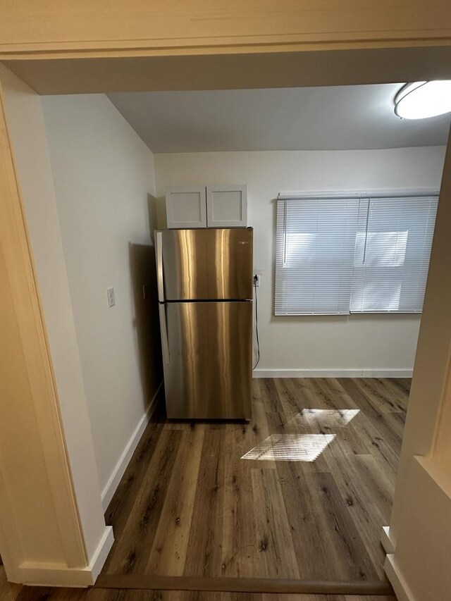 313 Grand Blvd, Loves Park, IL 61111 - kitchen featuring freestanding refrigerator, wood finished floors, and baseboards