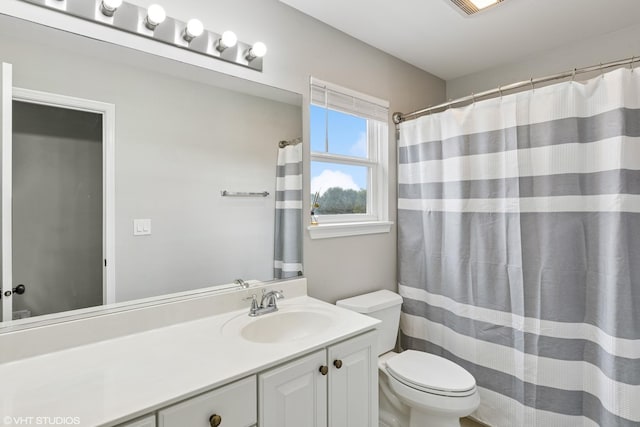 2758 Palm Springs Ln, Aurora, IL 60502 - bathroom with toilet, vanity, and curtained shower