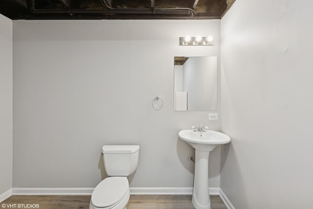 2758 Palm Springs Ln, Aurora, IL 60502 - bathroom with toilet, wood finished floors, baseboards, and a sink