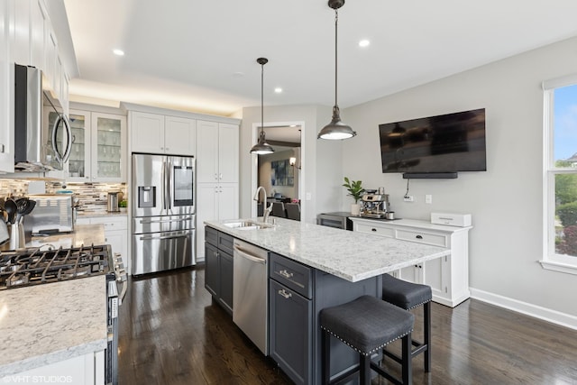 2758 Palm Springs Ln, Aurora, IL 60502 - kitchen featuring appliances with stainless steel finishes, a sink, white cabinetry, backsplash, and dark wood finished floors
