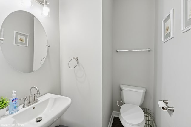 2758 Palm Springs Ln, Aurora, IL 60502 - half bathroom with a sink, toilet, and baseboards
