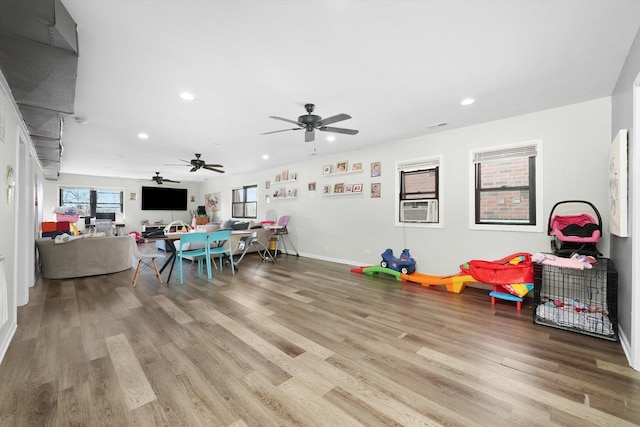 4854 W Addison St, Chicago, IL 60641 - rec room featuring recessed lighting, wood finished floors, healthy amount of natural light, a ceiling fan, and cooling unit