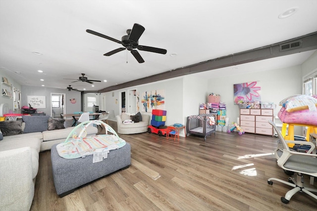 4854 W Addison St, Chicago, IL 60641 - living area with wood finished floors, recessed lighting, healthy amount of natural light, and a ceiling fan