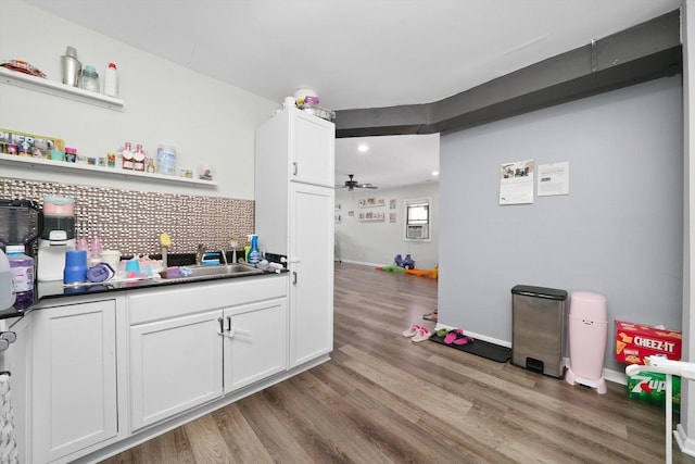4854 W Addison St, Chicago, IL 60641 - bar area with a sink, light wood-style floors, backsplash, and a ceiling fan