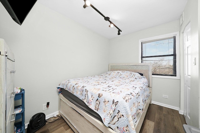 4854 W Addison St, Chicago, IL 60641 - bedroom with wood finished floors and baseboards