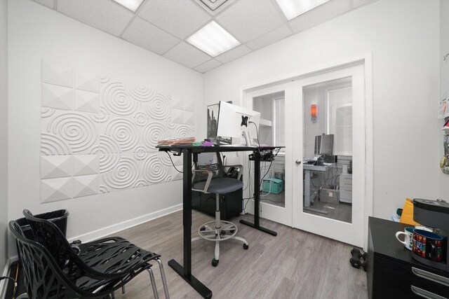 4854 W Addison St, Chicago, IL 60641 - office featuring french doors, a drop ceiling, wood finished floors, and baseboards