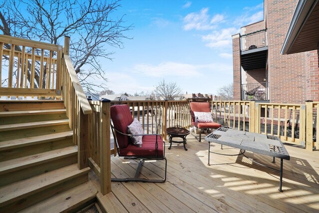 4854 W Addison St, Chicago, IL 60641 - wooden terrace featuring stairs and a fire pit