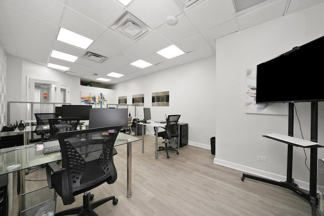 4854 W Addison St, Chicago, IL 60641 - office area with a drop ceiling, light wood finished floors, and baseboards
