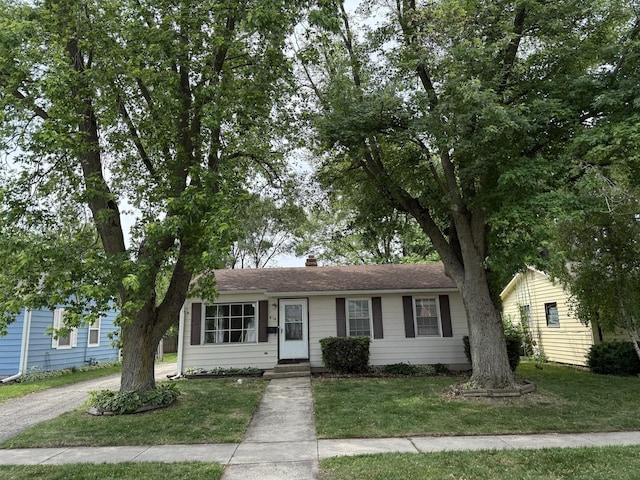 414 Spring Ave, Dekalb, IL 60115 - ranch-style house with a front yard and a chimney