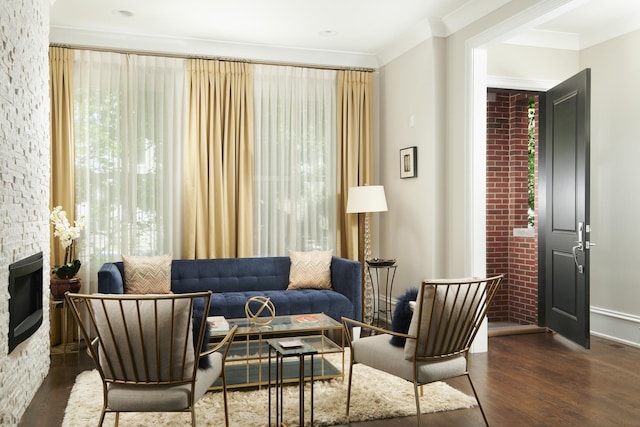 1617 N Bell Ave, Chicago, IL 60647 - living area featuring wood finished floors, crown molding, and a fireplace
