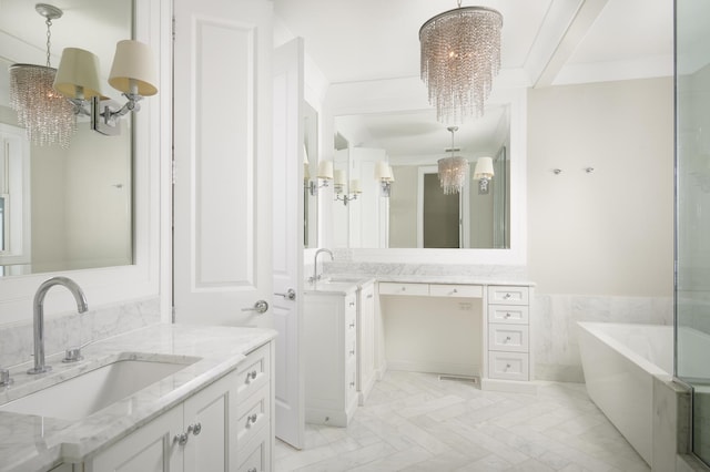 1617 N Bell Ave, Chicago, IL 60647 - full bathroom featuring a chandelier, a freestanding bath, two vanities, tile walls, and a wainscoted wall