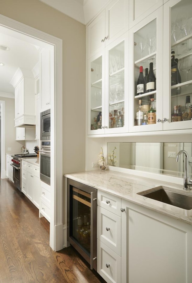 1617 N Bell Ave, Chicago, IL 60647 - indoor bar featuring wine cooler, stainless steel appliances, dark wood finished floors, and crown molding