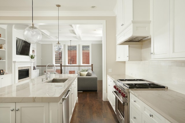 1617 N Bell Ave, Chicago, IL 60647 - kitchen featuring appliances with stainless steel finishes, open floor plan, coffered ceiling, a fireplace, and dark wood-style floors