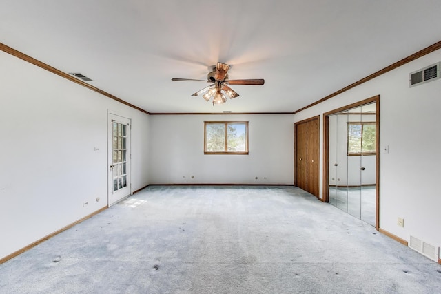 10117 Potter Rd, Des Plaines, IL 60016 - carpeted spare room featuring crown molding, a ceiling fan, and baseboards