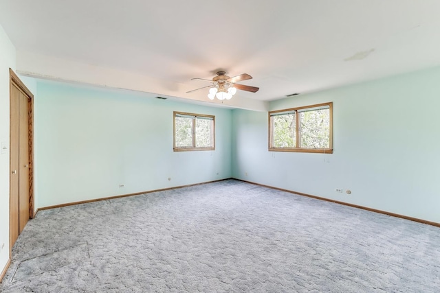 10117 Potter Rd, Des Plaines, IL 60016 - unfurnished bedroom with carpet flooring, baseboards, and ceiling fan