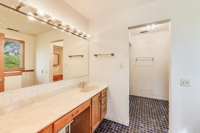 10117 Potter Rd, Des Plaines, IL 60016 - full bathroom with vanity, tile patterned floors, and a shower