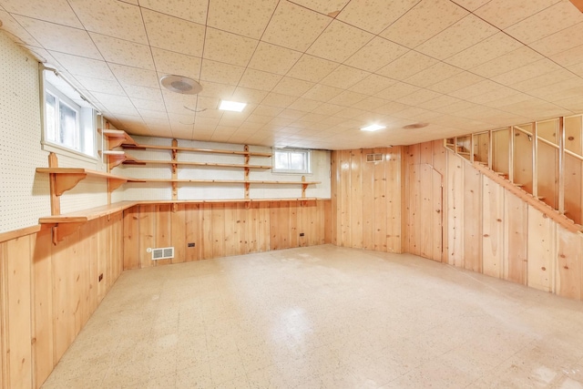 10117 Potter Rd, Des Plaines, IL 60016 - below grade area featuring wood walls and tile patterned floors
