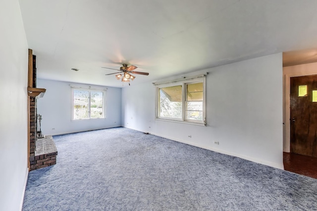 10117 Potter Rd, Des Plaines, IL 60016 - unfurnished living room with carpet flooring, ceiling fan, a fireplace, and baseboards