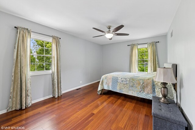 575 County Line Rd, Highland Park, IL 60035 - bedroom featuring multiple windows, wood finished floors, and baseboards