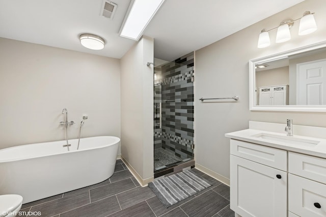 575 County Line Rd, Highland Park, IL 60035 - bathroom with a freestanding tub, tiled shower, baseboards, and vanity