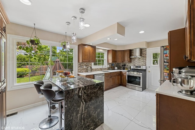 575 County Line Rd, Highland Park, IL 60035 - kitchen featuring appliances with stainless steel finishes, wall chimney range hood, a sink, light marble finish floors, and recessed lighting
