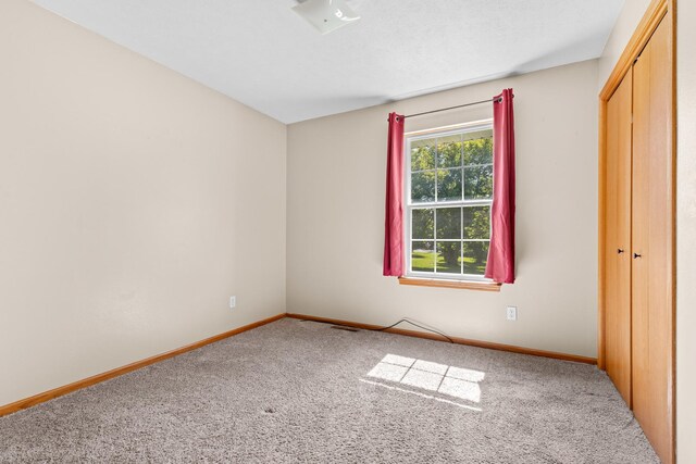 110 SW Benedict Dr, Poplar Grove, IL 61065 - unfurnished bedroom with carpet, baseboards, and a closet