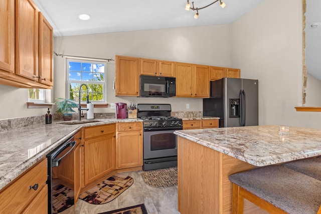 110 SW Benedict Dr, Poplar Grove, IL 61065 - kitchen featuring black appliances, a sink, a breakfast bar area, light stone countertops, and high vaulted ceiling