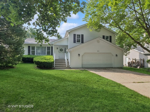 829 Brookside Dr, Bartlett, IL 60103 - tri-level home featuring a garage, a front yard, and concrete driveway