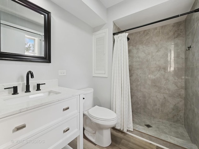 829 Brookside Dr, Bartlett, IL 60103 - full bath with wood finished floors, vanity, and tiled shower