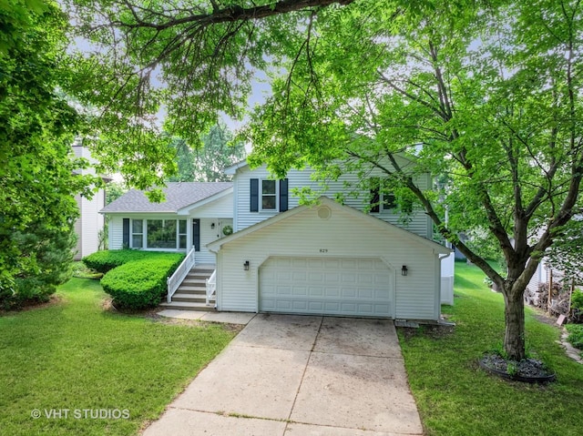 829 Brookside Dr, Bartlett, IL 60103 - split level home with a front yard, driveway, and an attached garage