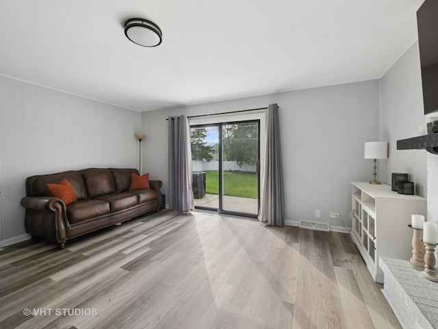 829 Brookside Dr, Bartlett, IL 60103 - living area featuring light wood-style floors and baseboards