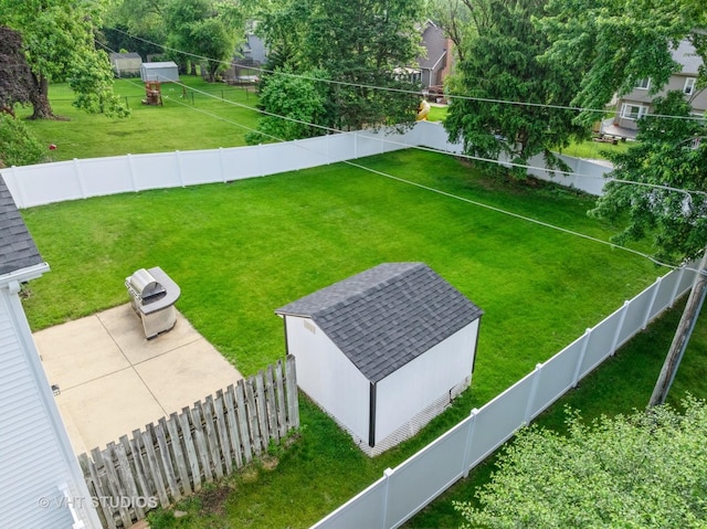 829 Brookside Dr, Bartlett, IL 60103 - fenced backyard featuring an outbuilding and a patio
