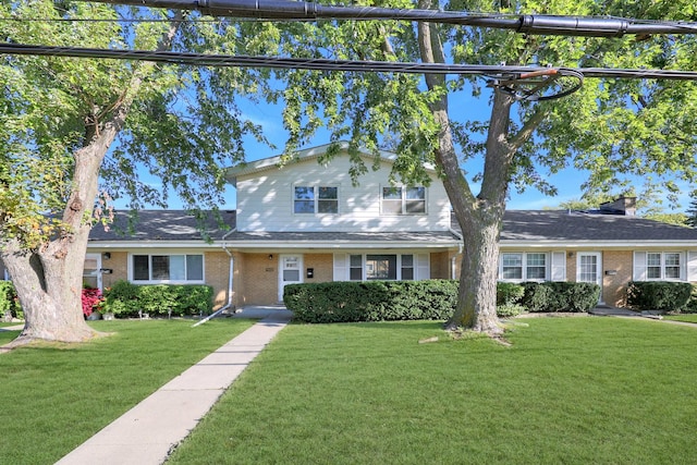 9002 N Clifton Ave, Niles, IL 60714 - traditional-style home featuring brick siding and a front yard