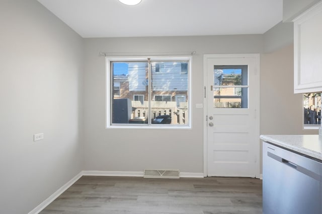 9002 N Clifton Ave, Niles, IL 60714 - doorway with light wood-style flooring and baseboards