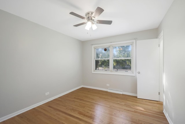 9002 N Clifton Ave, Niles, IL 60714 - empty room with baseboards, light wood-type flooring, and a ceiling fan