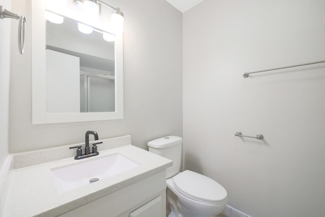 9002 N Clifton Ave, Niles, IL 60714 - bathroom with toilet, vanity, and a shower with door