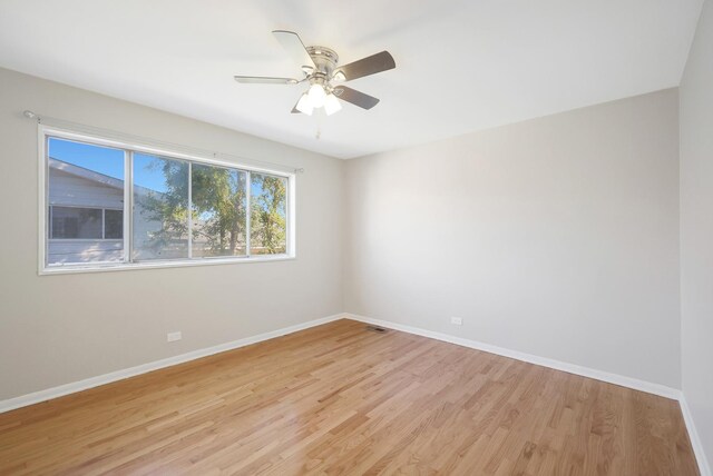 9002 N Clifton Ave, Niles, IL 60714 - unfurnished room with light wood-style flooring, baseboards, and ceiling fan